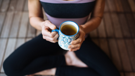 Woman sitting and holding a coffee mug