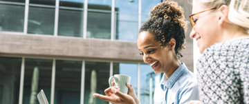 Women drinking coffee outside