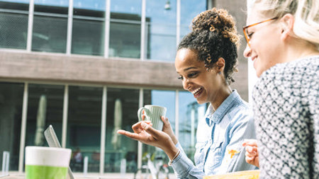 Women drinking coffee outside