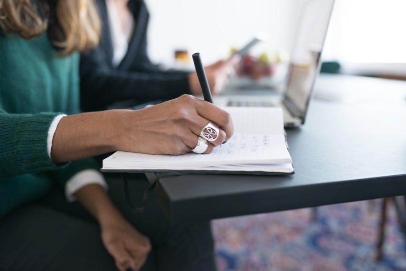 Woman writing in a notebook