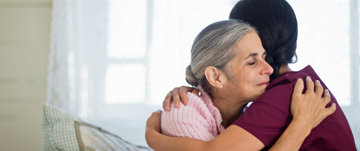 Nurse hugging a patient