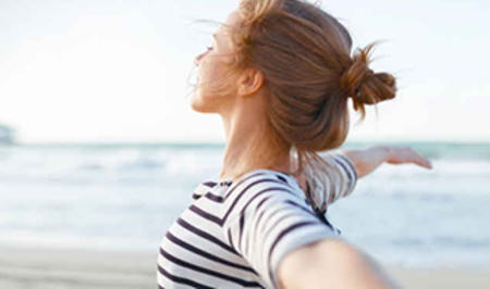 Woman stretching at the beach