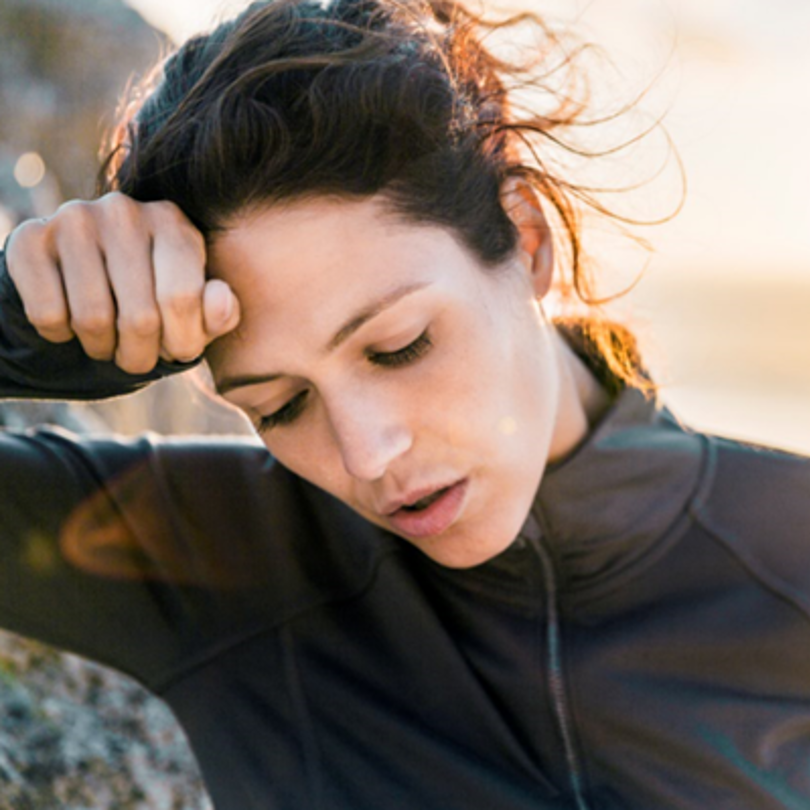 Woman holding her head in pain