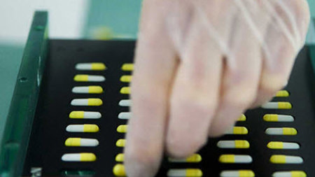 sorting pills in tray
